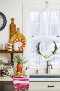 Fancy up your view with a unique wreath made from an embroidery hoop or a garland of lush greenery. What you'll need: embroidery hoop ($9, amazon.com), glue gun ($11, amazon.com)