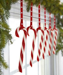 Keep candy canes out of kids' reach but on display by hanging them from a bough-decked window. Hook the peppermints on loops of polka-dot ribbon for added charm. What you'll need: candy canes ($10, amazon.com), garland ($20, amazon.com)