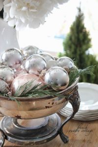 Shiny ball ornaments don't just look good on trees — they actually make for a lovely holiday centerpiece, tucked neatly into a bowl full of greens. See more at French Country Cottage » What you'll need: silver ornaments ($9, amazon.com), bowl ($20, amazon.com)